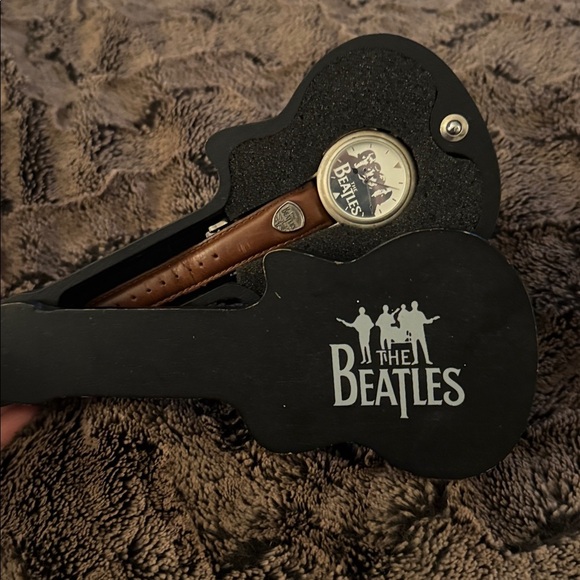 The Beatles Other - The Beatles Apple Corps Ltd. watch in its original wooden guitar-shaped case.
